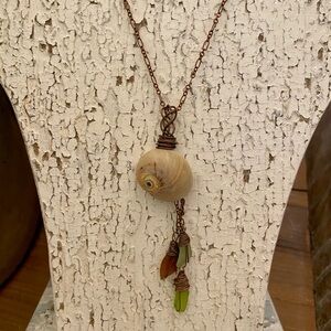 Handcrafted Shell Pendant Necklace with Green and Brown Accents